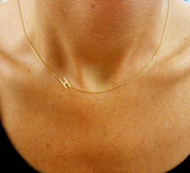 This sideways initial necklace is our top Pinterest pin! Get the original directly from I Love Jewelry Auctions.