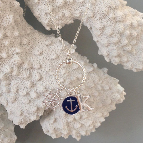 Our favorite Nautical Navy Anchor & Silver Initial Charm Necklace is a sassy summer style that screams preppy chic!