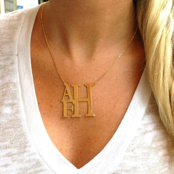Shop I Love Jewelry Auctions for our Stacked Modern Monogram Necklace to add a personalized style to your wardrobe. This style is a true classic with a unique twist.